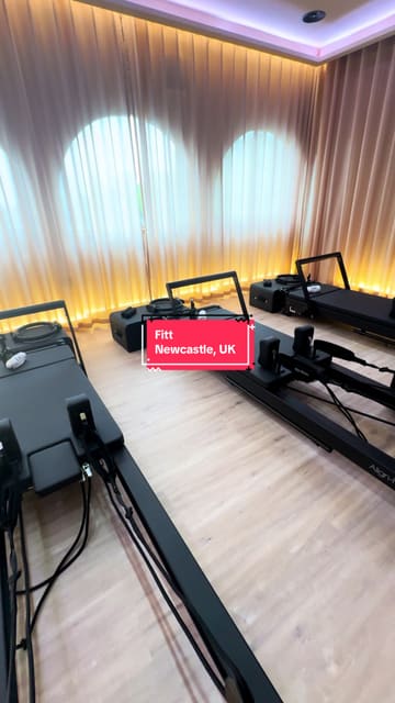 A promotional video showcasing the opening of Fitt, a new high-end Pilates studio and cafe in Newcastle. The video provides a tour of the facilities, including the studio space with reformer machines, the cafe area, and the luxury locker room amenities.