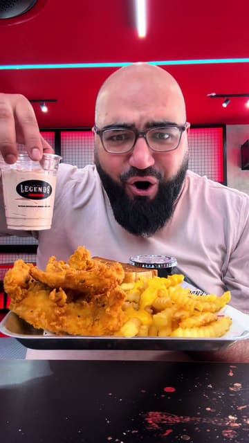 A creator visits Legends in Batley to review their smash burgers, chicken tenders, and desserts. The video features a mix of talking-head segments, close-ups of the food, and shots of the menu, providing a comprehensive overview of the dining experience.