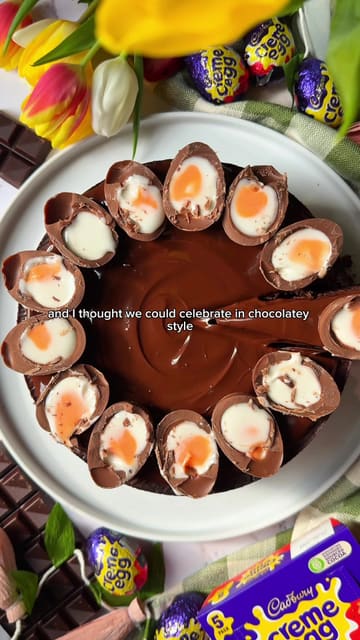 A home cooking tutorial demonstrating how to make a chocolate cake topped with Creme Eggs, using leftover Easter chocolate.