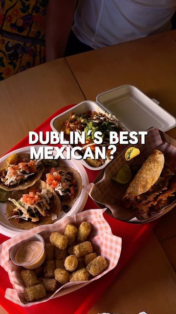 A review of La Cocina Cuevas in Naul, Co. Dublin, featuring a variety of Mexican dishes including tacos, a burrito, and loaded tater tots.