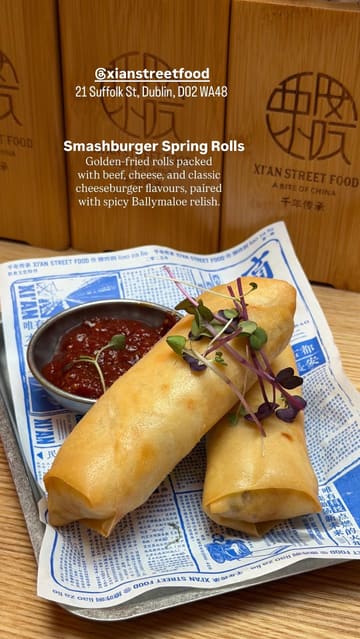 A short review-style video showcasing a visit to Xi'an Street Food, featuring a look at the menu, the restaurant interior, and the creator trying the smashburger spring rolls and Pad Thai.