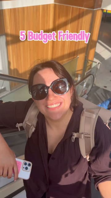 A travel-focused listicle video featuring a creator recommending five budget-friendly activities in Dublin, including visiting an Asian market, the National Gallery of Ireland, Poolbeg Tower, Dun Laoghaire, and grabbing a meal at Yum Thai.