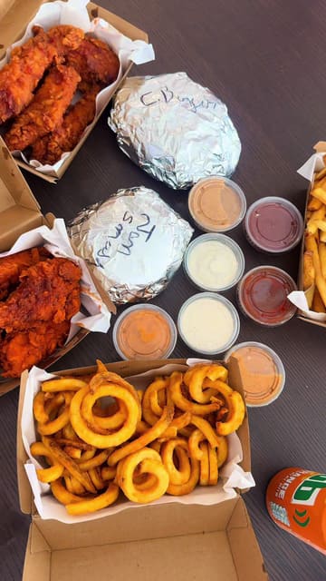 A creator visits the new Tuckkinn location at Hungr Hub in Sandyford, showcasing their signature tenders, the Truffle Jam Smash burger, and the Sweet TK Dip chicken burger, highlighting the unique sauces and overall quality of the food.
