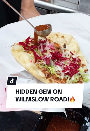 A food review video showcasing a shawarma restaurant called D Fresh in Manchester, featuring the preparation of a chicken shawarma wrap and the creator's taste test.