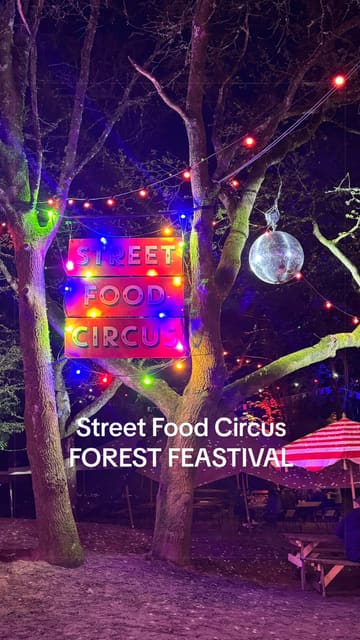 A fast-paced montage capturing a visit to the Forest Feastival street food event. The video highlights various food traders, including steak and cheesy mash, loaded fries, Sri Lankan lamb rolls, and desserts. It also showcases the festival's atmosphere, featuring outdoor seating in a wooded setting, cocktails, and live cabaret entertainment.