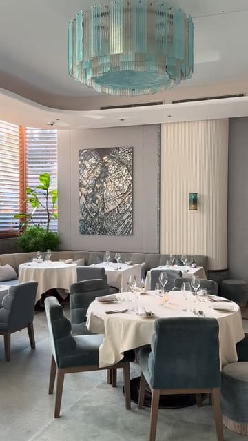 A high-end, cinematic showcase of Pavyllon London, featuring the restaurant's elegant interior, the chefs at work, and a series of beautifully plated dishes.