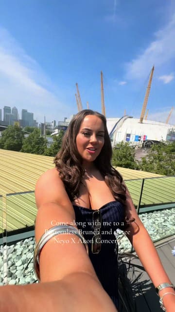 The video follows a creator's day out, starting with a bottomless brunch at a venue near the O2, followed by attending a Ne-Yo and Akon concert. The footage is primarily focused on the creator and her friends enjoying the experience, with quick cuts and energetic music.