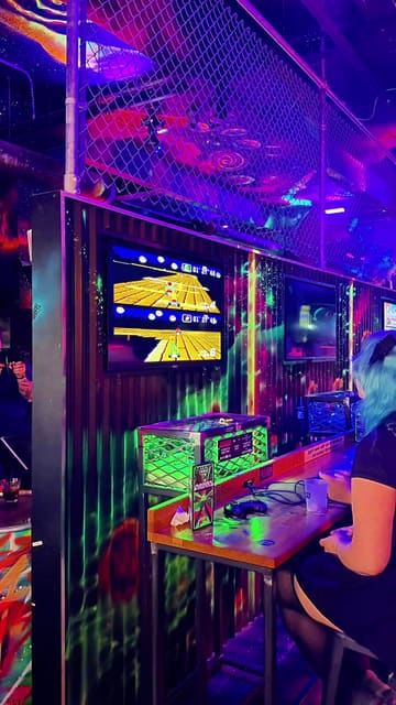 A short, upbeat video showcasing NQ64 Arcade Bar, highlighting the retro gaming experience and themed cocktails. The video features a montage of various arcade machines, the bar menu, and close-ups of signature drinks with gaming-inspired garnishes.