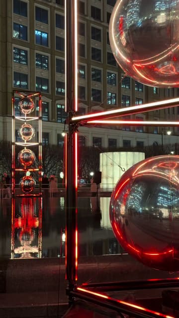 A montage of various light art installations located around the Canary Wharf area at night, highlighting the visual appeal of the free Winter Lights event.