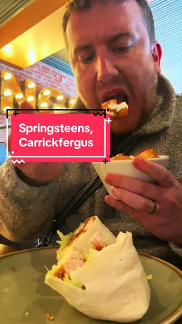A creator reviews Springsteens in Carrickfergus, Northern Ireland, showcasing the interior, menu, and specific dishes like the Sinatra Wrap and Hickory Burger.