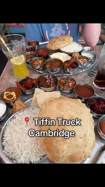 A short, handheld review of a thali meal at Tiffin Truck in Cambridge, featuring the creator trying the food and showing the menu.