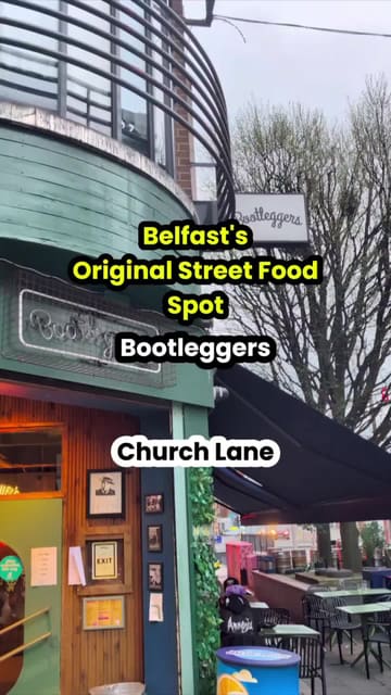 A creator visits Bootleggers in Belfast, providing a tour of the venue and a review of their street food menu, including burgers, tacos, nachos, and cocktails.