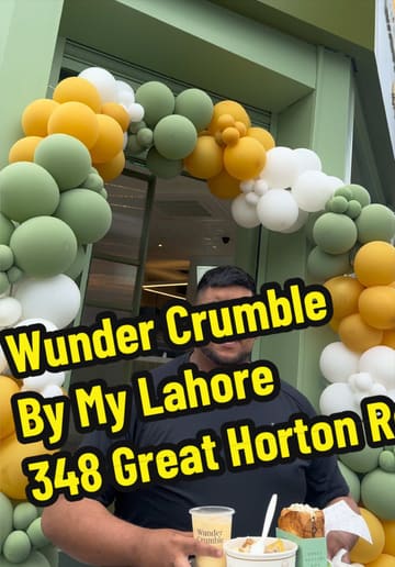 A creator reviews the food offerings at Wunder Crumble by MyLahore, showcasing loaded fries, a toastie, and a boba tea.