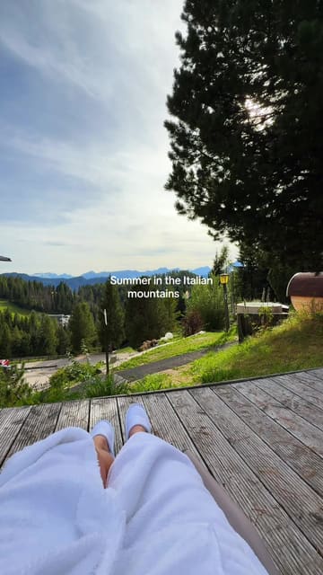 A short, POV-style video showcasing a sauna and hot tub facility at a resort in the Italian Dolomites, emphasizing the scenic mountain views.
