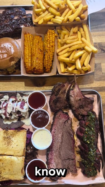 A review of a Texas BBQ smokehouse in London, featuring a large meat platter including brisket, ribs, and a smash burger.