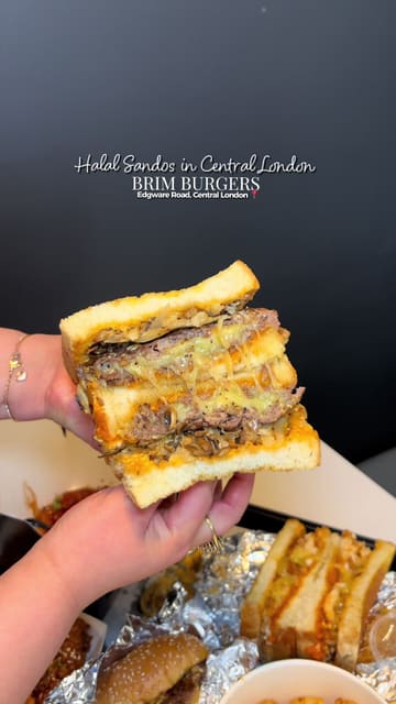 A short, punchy video showcasing various menu items from Brim Burgers on Edgware Road, including sandos, beef burgers, chicken tenders, and cheesy tater tots.