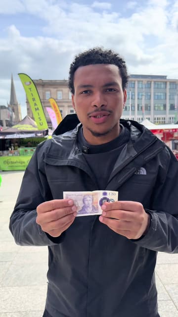 The creator attempts a £20 food challenge at the Nottingham Market Square, visiting multiple stalls to sample a variety of international street food, including a kangaroo burger, Moroccan-style meatballs, and Gambian dishes like goat curry and jollof rice.
