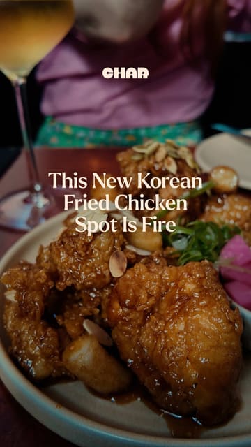A creator visits Bar Anam in Dublin, highlighting the Korean fried chicken spot 'Dak' located inside. The video features a tour of the venue, a look at the cocktail menu, and a taste test of various dishes including dumplings, kimchi corn cheese pancake, and Korean fried chicken.