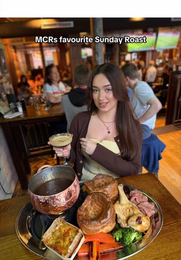 A short, punchy reel showcasing the 'Roast Cauldron Feast' at Dirty O'Sullivans in Manchester. The video features close-up shots of the roast dinner, a satisfying gravy pour, dessert, and drinks, set to music with text overlays highlighting the offer.