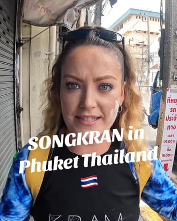 A first-person vlog capturing the Songkran festival in Phuket, Thailand, featuring the creators riding on a truck and participating in a city-wide water fight.