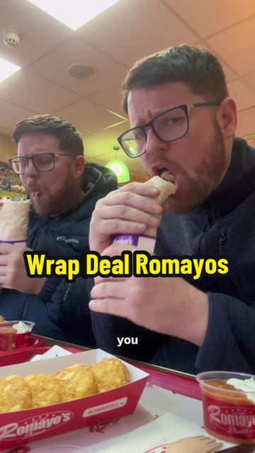 Two creators review a 'Wrap Combo' deal at Romayos, highlighting the price, protein content, and quality of the grilled chicken. They film themselves ordering at a kiosk and then eating the meal, providing their honest feedback on the taste and value.