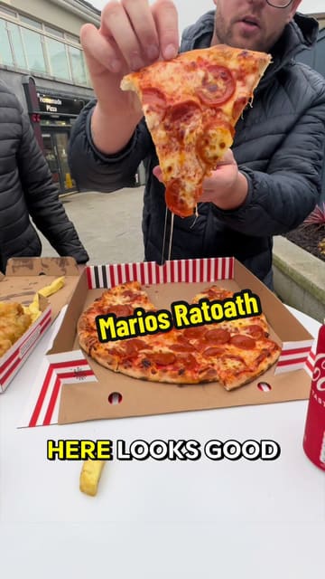 A casual, handheld review of a local takeaway ('chipper') in Ratoath, where two creators sample pizza, chicken, chips, sausage, and fish, providing their honest feedback on the food and the gravy.