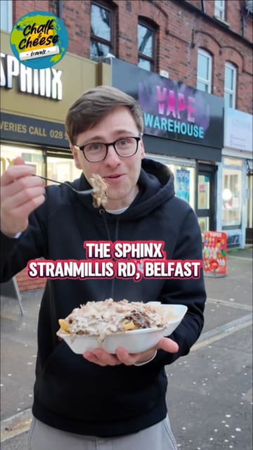 A food review video featuring a creator trying a mixed kebab on chips and chicken goujons from The Sphinx in Belfast. The creator provides commentary on the taste, portion size, and value, ultimately giving the venue a high rating.