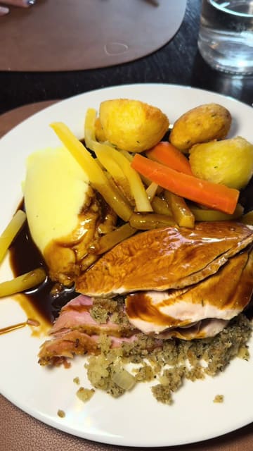 A video review of a carvery at The Courtyard Hotel in Leixlip, Kildare. The creator walks through the venue, shows the serving process, and reviews the roast dinner, specifically commenting on the turkey and ham.
