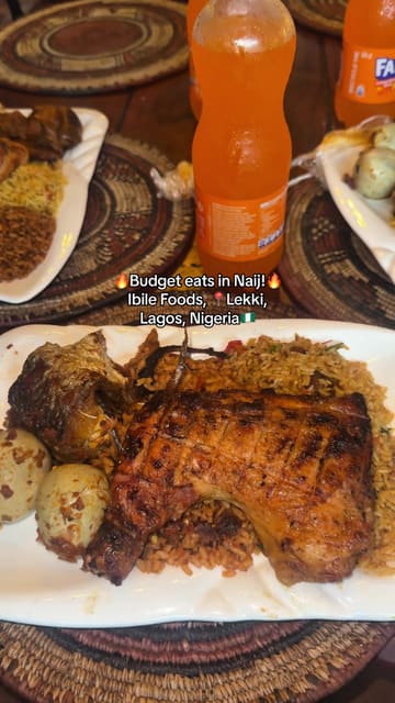 A creator visits Ibile Foods in Lekki, Nigeria, showcasing the buffet-style selection of traditional Nigerian dishes. The video includes a review of the food, specifically highlighting the jollof rice, chicken, and chicken suya, while emphasizing the affordability of the meal.