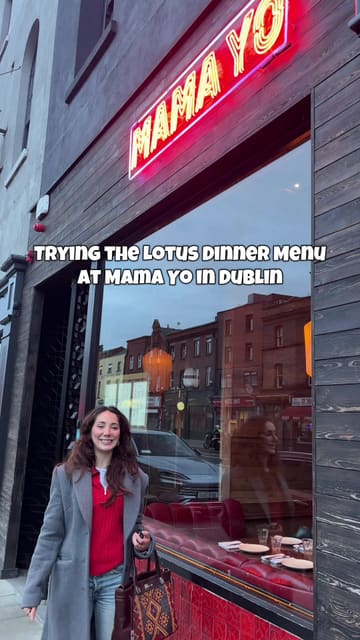 A vlog-style review of Mama Yo in Dublin, featuring the creator's experience with the 'Lotus Dinner Menu'. The video includes shots of the restaurant's interior, the menu, various dishes like salt and chili squid and soft shell crab, and the dessert service.