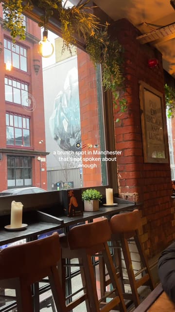 A short, punchy montage showcasing a brunch menu at The Pen and Pencil in Manchester. The video features various dishes including a wrap, bagel, fries, and tater tots, alongside coffee and smoothies, set to music with text overlays.
