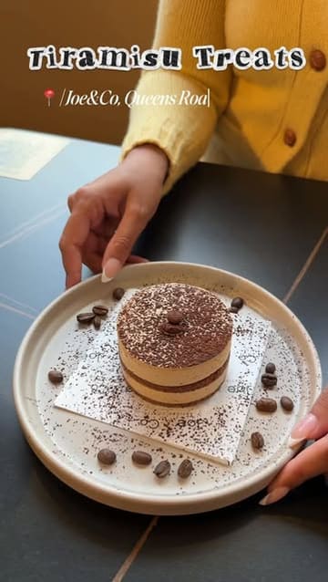A short, aesthetic video showcasing three tiramisu-themed items at Joe & Co. in Leicester, including a cheesecake, French toast, and a pour-over latte.