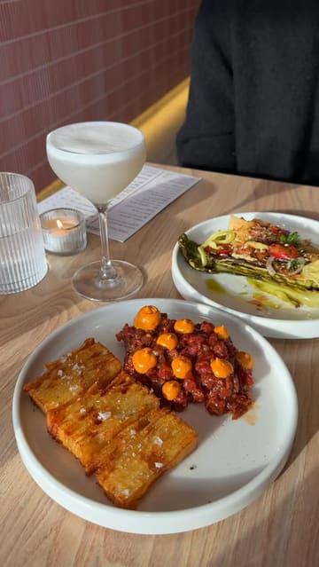 A review of Drip L8 in Belfast, highlighting their small plates, pasta dishes, and desserts. The video features close-up shots of the food, including steak tartare, charred cabbage, and various pasta dishes, alongside the creator's commentary on the quality and flavors.