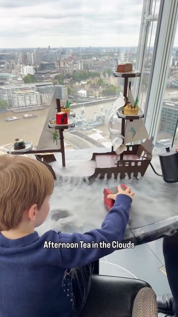 A mother and son enjoy a Peter Pan-themed afternoon tea at Aqua Shard, featuring creative food presentation and skyline views.