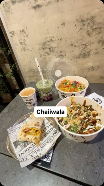 A short, energetic video showcasing the breakfast and lunch offerings at a Chaiiwala branch. The video features quick cuts of the menu, the interior decor, and close-ups of various dishes including roti wraps, hash browns, karak chai, and rice bowls.