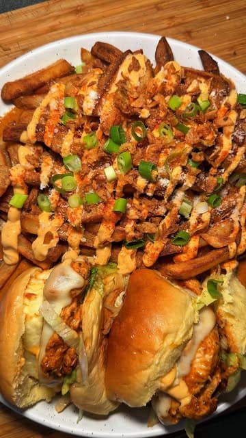A home-cooking recipe video demonstrating how to make a 'Nando's style' dipped burger and loaded fries.