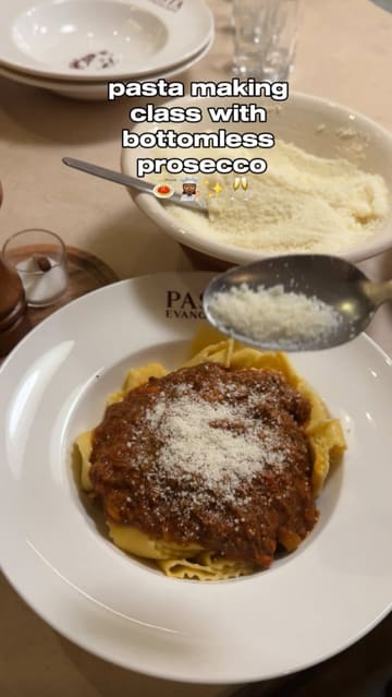 A couple attends a pasta-making class at Pasta Evangelists, documenting the experience from arrival to the final meal. The video features the chef's instruction, the hands-on process of making pasta, the starters, the main course, and a concluding limoncello shot.