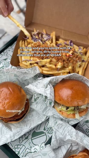 A short, punchy video showcasing a variety of vegan burgers, loaded fries, and milkshakes from a street food venue. The video uses handheld, close-up shots to highlight the textures and presentation of the food.