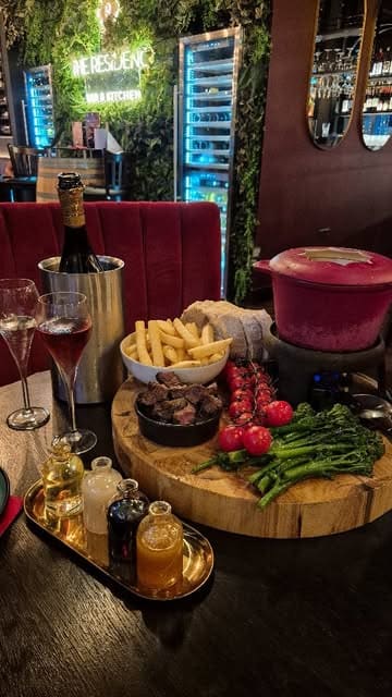 A promotional reel for a bottomless brunch at The Residence, featuring cheese fondue, steak, and prosecco.