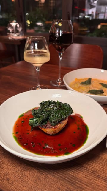 A montage video showcasing the interior, food, and drinks at a restaurant called Templar in Stratford, London. The video features close-up shots of various dishes like smoked duck breast, truffle ravioli, and pigs head croquette, alongside cocktails and wine, with text overlays indicating prices.