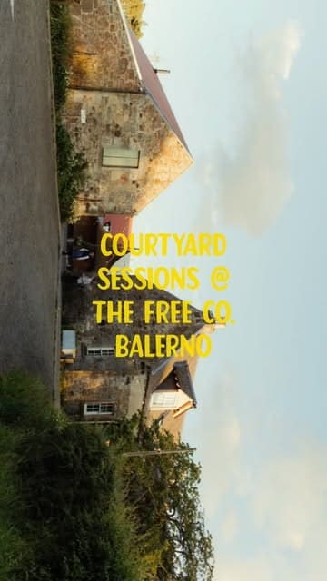 A short video showcasing a 'Courtyard Sessions' event at The Free Company in Balerno, featuring the preparation of BBQ beef brisket burgers, charred corn, and smoked potatoes in an outdoor setting.