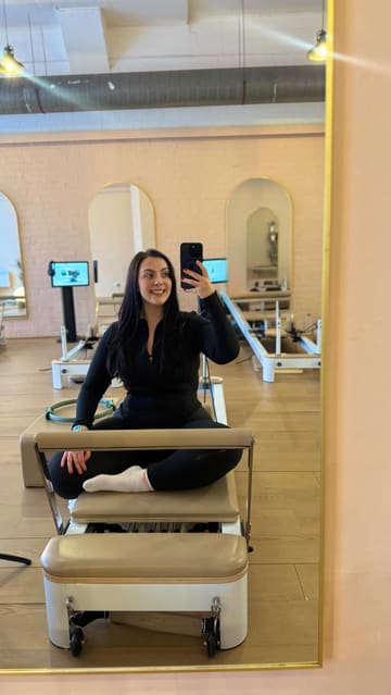 A creator visits Aira Pilates in Glasgow to try out their on-demand reformer Pilates classes for the first time. She documents the process from setting up an account to the workout itself, sharing her personal experience of the intensity and the supportive nature of the instructor.