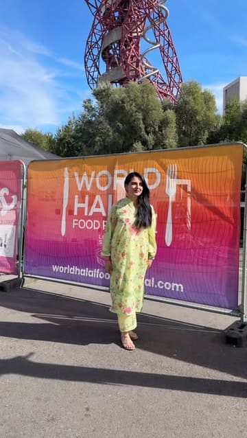 The creator visits the World Halal Food Festival in London, showcasing various street food vendors and highlighting a specific brand, Falak Foods, at their promotional booth. The video features the creator trying different foods and reviewing a new chili crunch product.