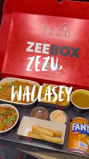 A short video showcasing a 'ZeeBox' meal deal from Zezu, featuring a variety of Chinese-style takeaway dishes including noodles, salt and pepper chips, dragon chicken, spring rolls, and a chocolate dessert. The video includes shots of the food packaging, the venue interior, and the menu board.