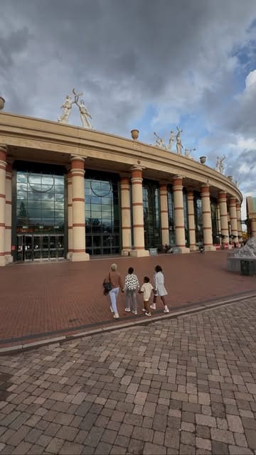 A family vlog showcasing a day out at the Trafford Centre, highlighting activities like adventure golf, laser quest, and a visit to a frozen yogurt shop.