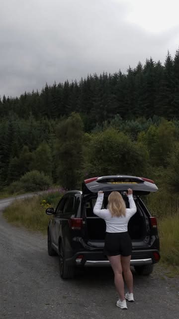 A cinematic, aesthetic montage showcasing a stay at a cottage in the Scottish Highlands, featuring scenic drives, nature views, and cozy indoor moments.