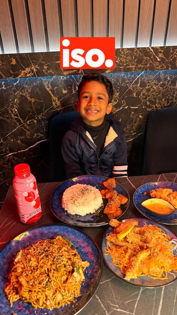 A young creator visits ISO Sushi, providing a review of the food and experience. The video features shots of the exterior, interior, and various dishes including sushi, tempura, and mochi, with the creator offering commentary on the taste and texture.