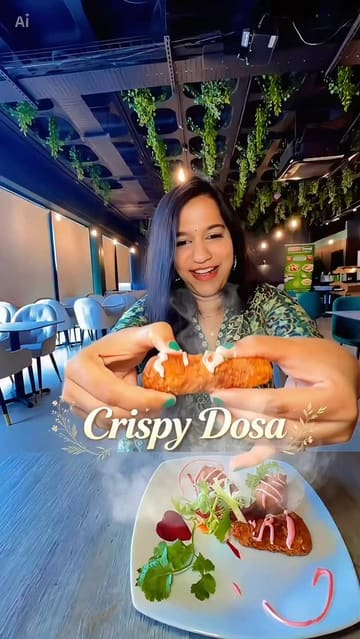 A family-focused review of Crispy Dosa, highlighting their new plant-based menu. The video features the creator and her children trying a variety of dishes, including dosas, starters, and desserts, in a casual, family-friendly setting.