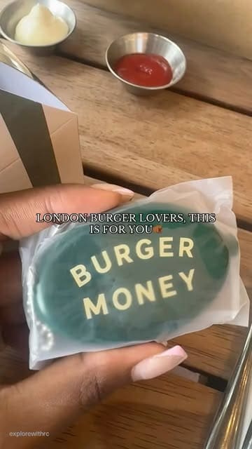 A short, quick-cut video showcasing a limited-edition 'classic box' takeaway from a burger venue. The video features an unboxing of the meal, including a beef burger, fries, a soft drink, and some nostalgic extras.