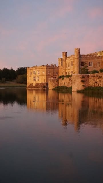 A montage video showcasing an overnight stay at Leeds Castle, highlighting the historic architecture, the bedroom interiors, and the scenic castle grounds.